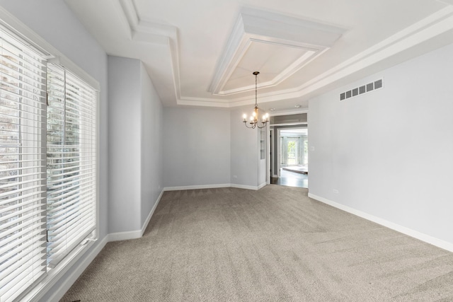 499 Waubonsee Cir, Oswego, IL 60543 - carpeted spare room featuring a tray ceiling, a chandelier, and baseboards