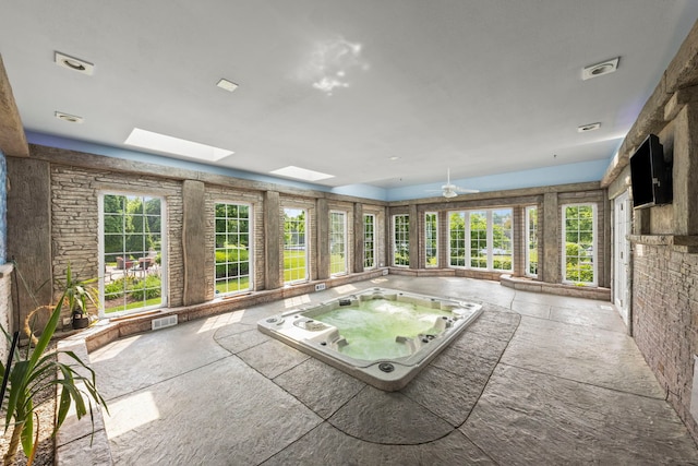 499 Waubonsee Cir, Oswego, IL 60543 - unfurnished sunroom featuring a jacuzzi and a skylight
