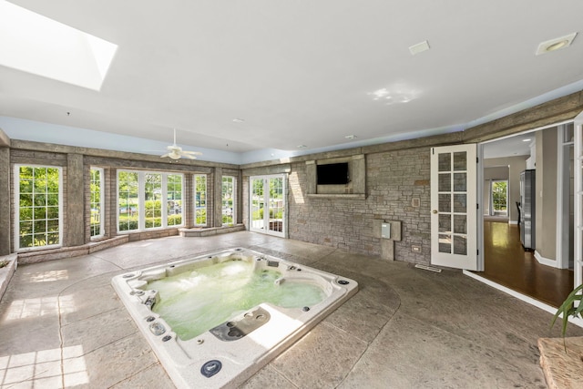 499 Waubonsee Cir, Oswego, IL 60543 - unfurnished sunroom with a hot tub and a skylight