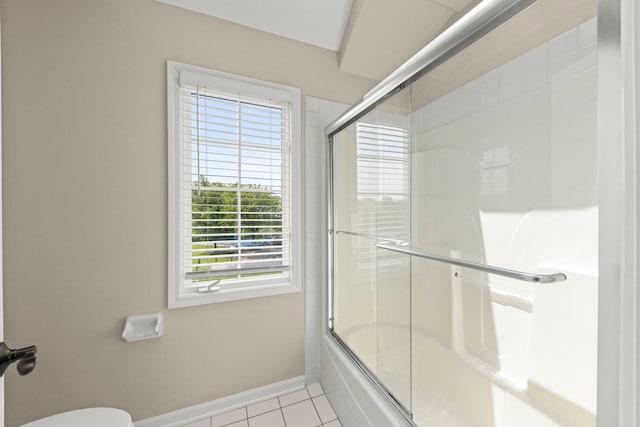499 Waubonsee Cir, Oswego, IL 60543 - full bath with shower / bath combination with glass door, tile patterned flooring, baseboards, and toilet