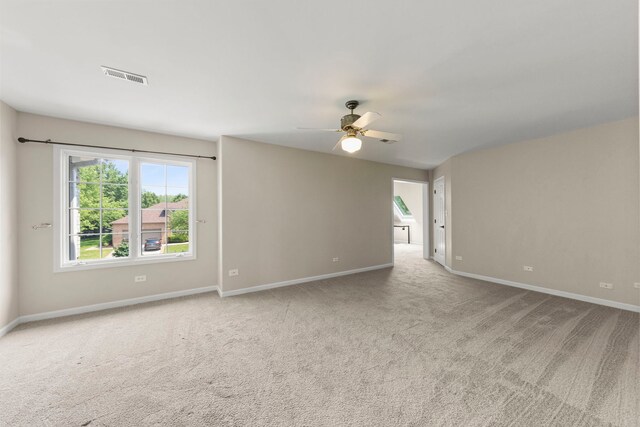499 Waubonsee Cir, Oswego, IL 60543 - empty room featuring ceiling fan, carpet flooring, and baseboards