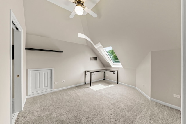 499 Waubonsee Cir, Oswego, IL 60543 - bonus room with a skylight, carpet flooring, vaulted ceiling, baseboards, and a ceiling fan