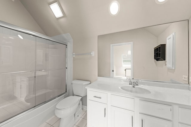 499 Waubonsee Cir, Oswego, IL 60543 - full bath with toilet, vanity, tile patterned flooring, enclosed tub / shower combo, and lofted ceiling