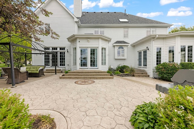 499 Waubonsee Cir, Oswego, IL 60543 - back of house with outdoor lounge area, a patio area, entry steps, and a chimney