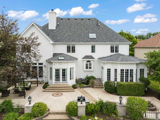 499 Waubonsee Cir, Oswego, IL 60543 - rear view of property featuring a patio, french doors, a chimney, and a shingled roof