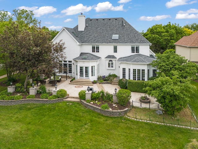 499 Waubonsee Cir, Oswego, IL 60543 - rear view of house with french doors, a patio area, a chimney, a shingled roof, and entry steps