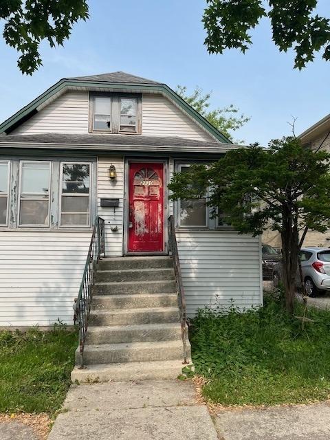 2130 N 74th Ct, Elmwood Park, IL 60707 - bungalow-style house featuring entry steps and roof with shingles