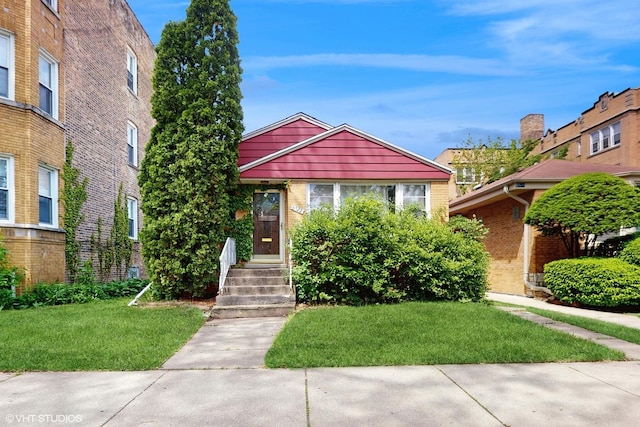 6522 N Sacramento Ave, Chicago, IL 60645 - view of front facade with a front lawn and brick siding