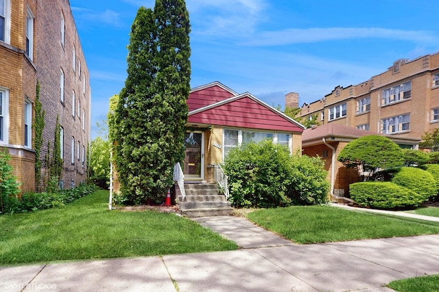 6522 N Sacramento Ave, Chicago, IL 60645 - view of front of house featuring a front lawn and brick siding