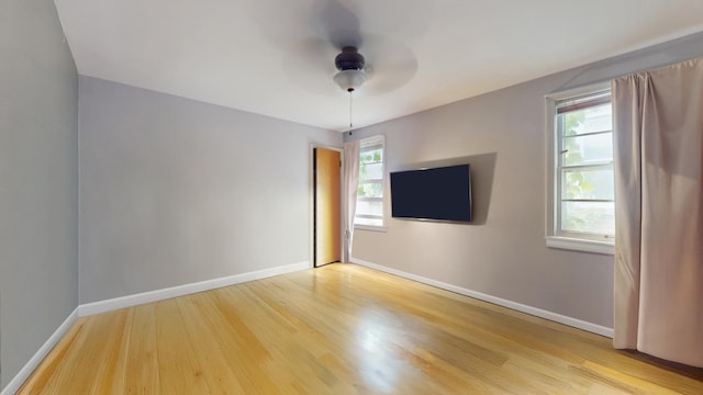 6522 N Sacramento Ave, Chicago, IL 60645 - empty room with wood finished floors, ceiling fan, and baseboards