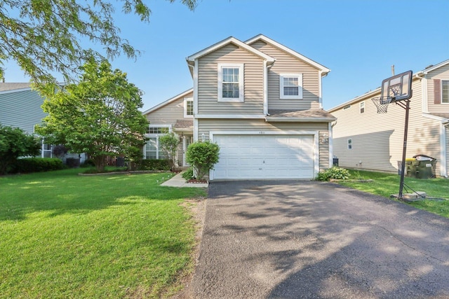4801 Bordeaux Dr, Lake In The Hills, IL 60156 - traditional home with an attached garage, asphalt driveway, and a front yard