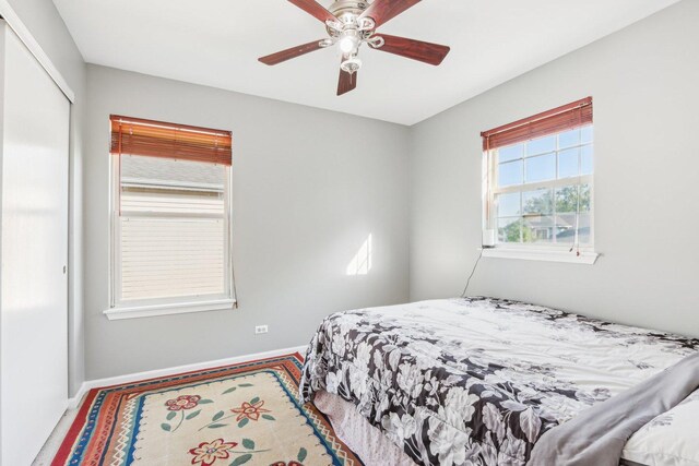 4801 Bordeaux Dr, Lake In The Hills, IL 60156 - carpeted bedroom featuring baseboards, a closet, and ceiling fan