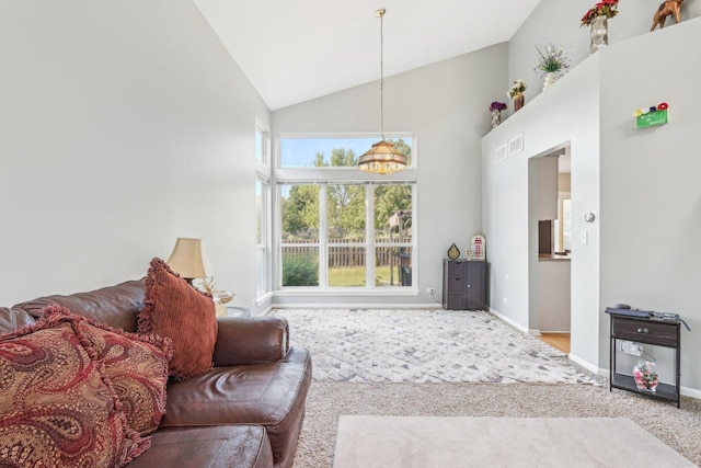 4801 Bordeaux Dr, Lake In The Hills, IL 60156 - carpeted living area featuring baseboards and high vaulted ceiling