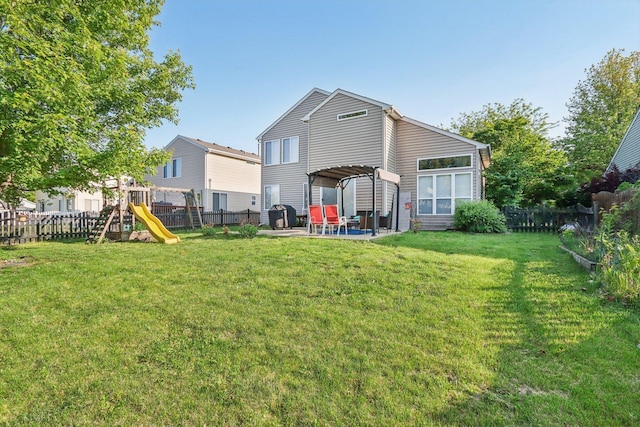 4801 Bordeaux Dr, Lake In The Hills, IL 60156 - back of house with a patio and a playground