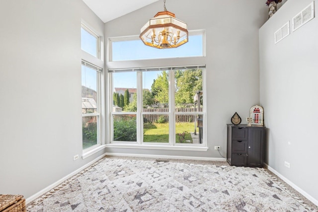 4801 Bordeaux Dr, Lake In The Hills, IL 60156 - interior space with a chandelier, carpet flooring, baseboards, and high vaulted ceiling
