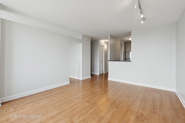 444 W Fullerton Pkwy Unit 1702, Chicago, IL 60614 - unfurnished room with light wood-type flooring and track lighting