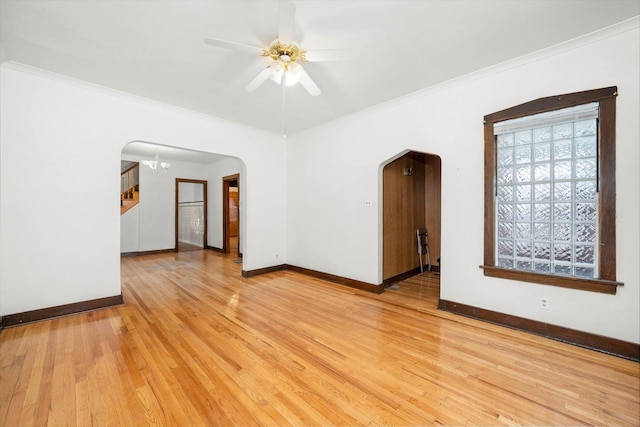 3523 W 60th Pl, Chicago, IL 60629 - unfurnished room featuring arched walkways, baseboards, a ceiling fan, and ornamental molding