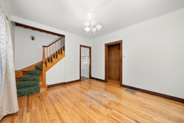 3523 W 60th Pl, Chicago, IL 60629 - empty room featuring a chandelier, light wood-style floors, stairs, baseboards, and crown molding
