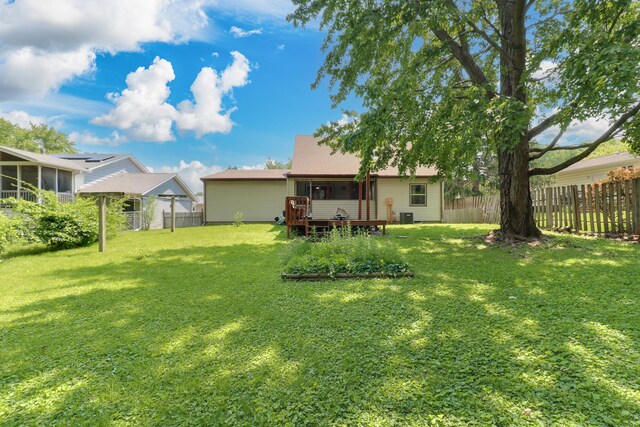 301 Columbia Dr, Normal, IL 61761 - fenced backyard with a sunroom