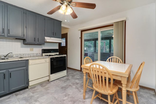 301 Columbia Dr, Normal, IL 61761 - kitchen featuring gas stove, white dishwasher, under cabinet range hood, light countertops, and a ceiling fan