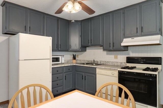301 Columbia Dr, Normal, IL 61761 - kitchen with white appliances, extractor fan, ceiling fan, light countertops, and decorative backsplash