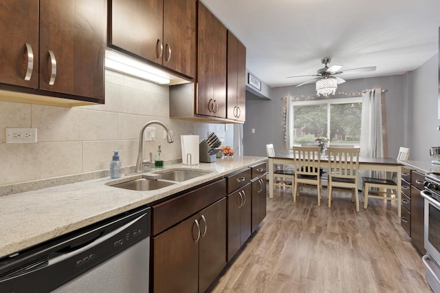 2642 N Windsor Dr Unit 102, Arlington Heights, IL 60004 - kitchen featuring stainless steel appliances, a sink, light wood-type flooring, decorative backsplash, and a ceiling fan