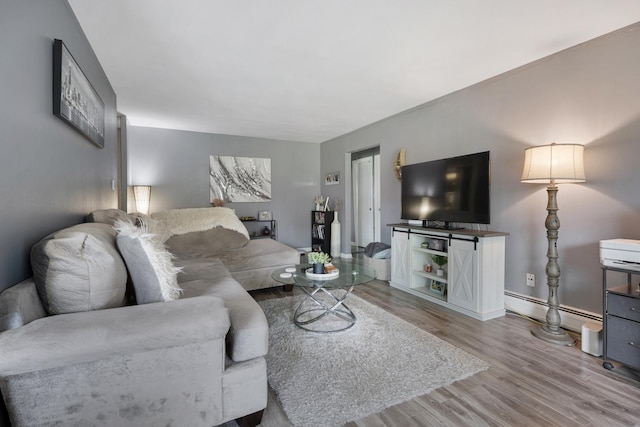 2642 N Windsor Dr Unit 102, Arlington Heights, IL 60004 - living room with wood finished floors, baseboards, and baseboard heating