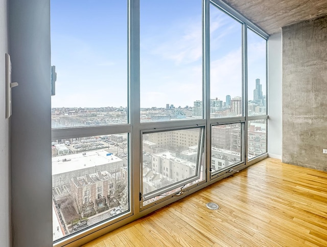 1845 S Michigan Ave Unit 1602, Chicago, IL 60616 - empty room featuring a skyline view, wood finished floors, and expansive windows