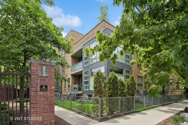 1307 W Wrightwood Ave Unit 201, Chicago, IL 60614 - view of apartment building / complex featuring a fenced front yard
