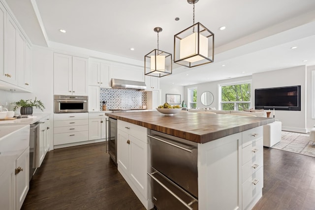 1307 W Wrightwood Ave Unit 201, Chicago, IL 60614 - kitchen with wooden counters, open floor plan, dark wood finished floors, and recessed lighting