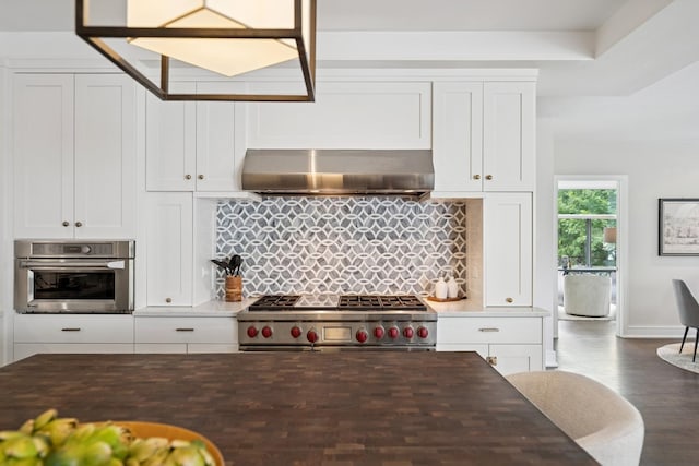 1307 W Wrightwood Ave Unit 201, Chicago, IL 60614 - kitchen with appliances with stainless steel finishes, wall chimney range hood, backsplash, wood finished floors, and white cabinets