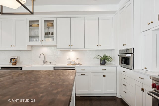 1307 W Wrightwood Ave Unit 201, Chicago, IL 60614 - kitchen featuring white cabinets and glass insert cabinets