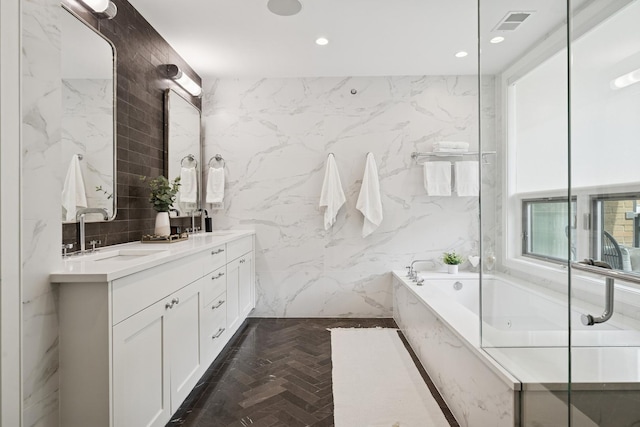 1307 W Wrightwood Ave Unit 201, Chicago, IL 60614 - full bathroom featuring a bath, double vanity, brick flooring, tile walls, and recessed lighting