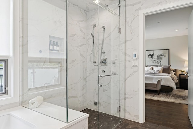1307 W Wrightwood Ave Unit 201, Chicago, IL 60614 - bathroom featuring ensuite bath, a marble finish shower, a bath, and wood finished floors