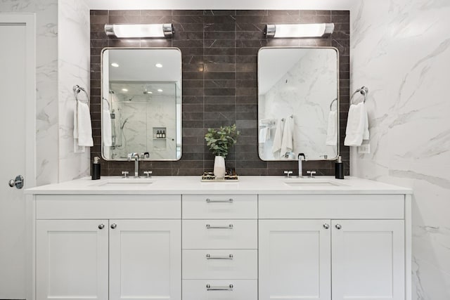 1307 W Wrightwood Ave Unit 201, Chicago, IL 60614 - full bathroom with a marble finish shower, tile walls, and double vanity