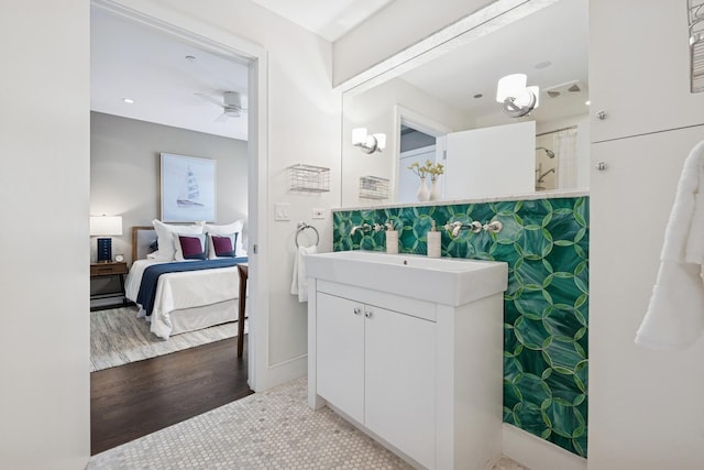 1307 W Wrightwood Ave Unit 201, Chicago, IL 60614 - bathroom featuring vanity, ensuite bathroom, a shower, ceiling fan, and wood finished floors