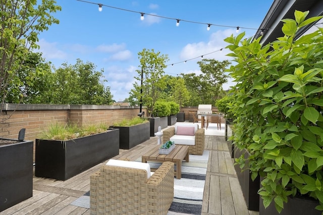 1307 W Wrightwood Ave Unit 201, Chicago, IL 60614 - wooden terrace featuring an outdoor hangout area and exterior kitchen