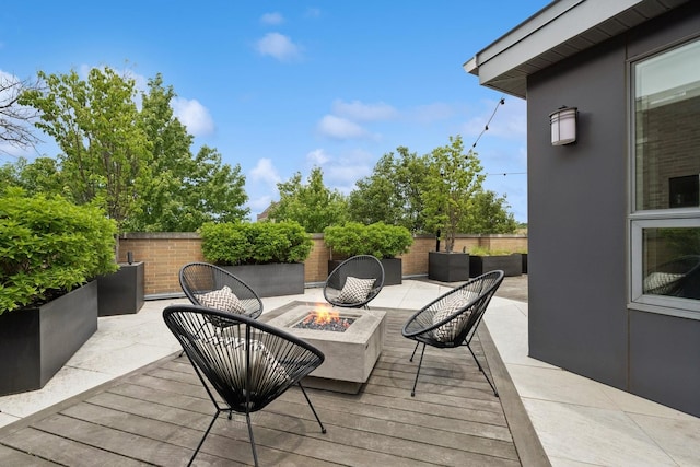 1307 W Wrightwood Ave Unit 201, Chicago, IL 60614 - wooden deck with a fire pit and a patio