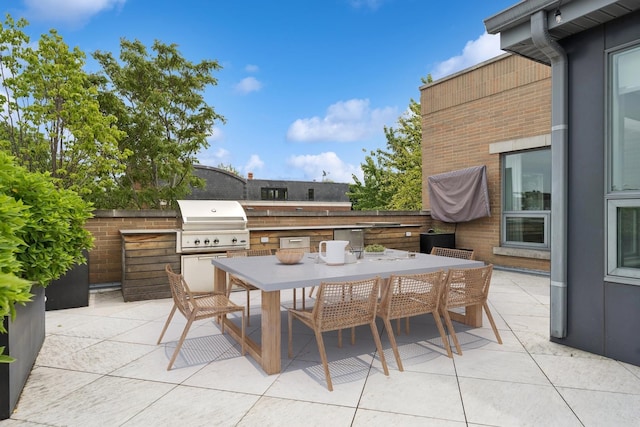 1307 W Wrightwood Ave Unit 201, Chicago, IL 60614 - view of patio with an outdoor kitchen and outdoor dining space