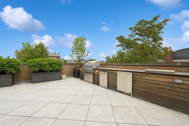 1307 W Wrightwood Ave Unit 201, Chicago, IL 60614 - view of patio featuring exterior kitchen