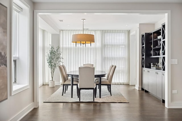 1307 W Wrightwood Ave Unit 201, Chicago, IL 60614 - dining space featuring dark wood-style flooring and baseboards