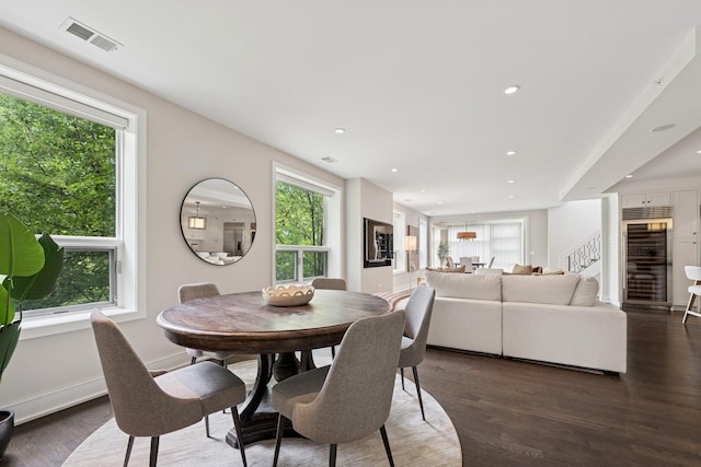 1307 W Wrightwood Ave Unit 201, Chicago, IL 60614 - dining room featuring wine cooler, stairs, wood finished floors, and recessed lighting