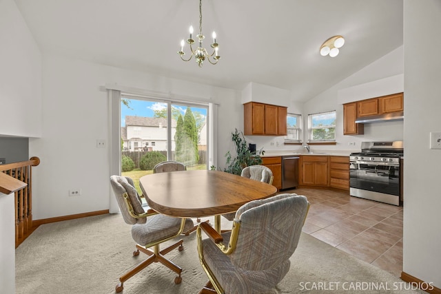 664 Birchwood Dr, Bolingbrook, IL 60490 - dining room with vaulted ceiling, plenty of natural light, a chandelier, and light colored carpet
