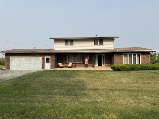 1645 Meadowview Ln, Wilmington, IL 60481 - traditional home with a garage, driveway, covered porch, a front yard, and brick siding