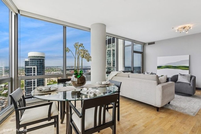 1235 S Prairie Ave Unit 3605, Chicago, IL 60605 - dining room featuring expansive windows, wood finished floors, and a city view