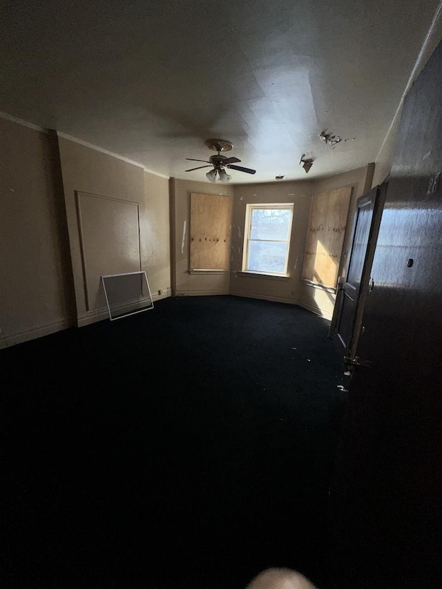 7425 S Harvard Ave, Chicago, IL 60621 - empty room featuring dark carpet and a ceiling fan