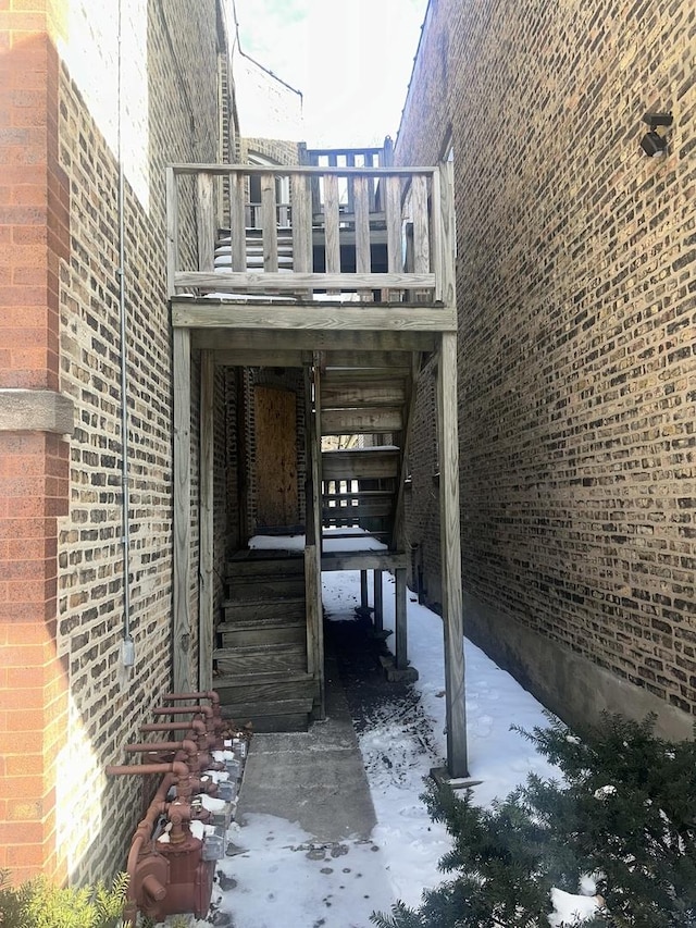 7425 S Harvard Ave, Chicago, IL 60621 - view of property exterior with stairs, brick siding, and a wooden deck