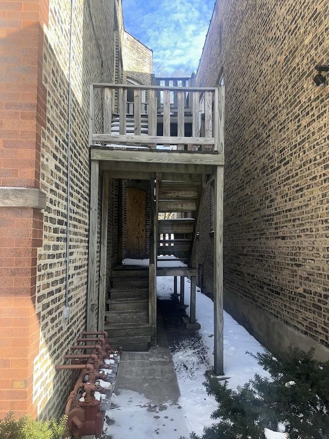 7425 S Harvard Ave, Chicago, IL 60621 - view of home's exterior with stairs, brick siding, and a deck