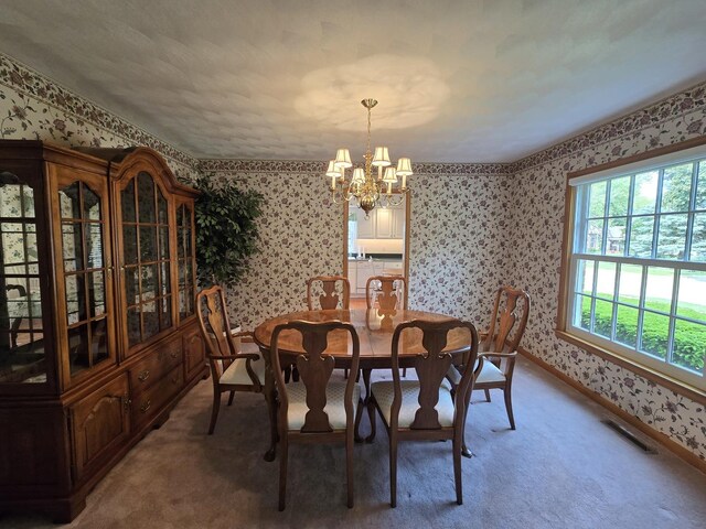 210 S Ridge St, Shannon, IL 61078 - dining room with wallpapered walls, a chandelier, light carpet, and baseboards