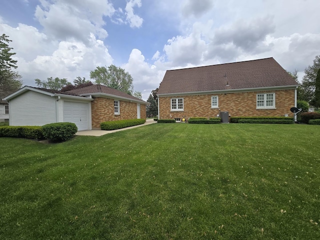 210 S Ridge St, Shannon, IL 61078 - back of house featuring a yard, an attached garage, and cooling unit